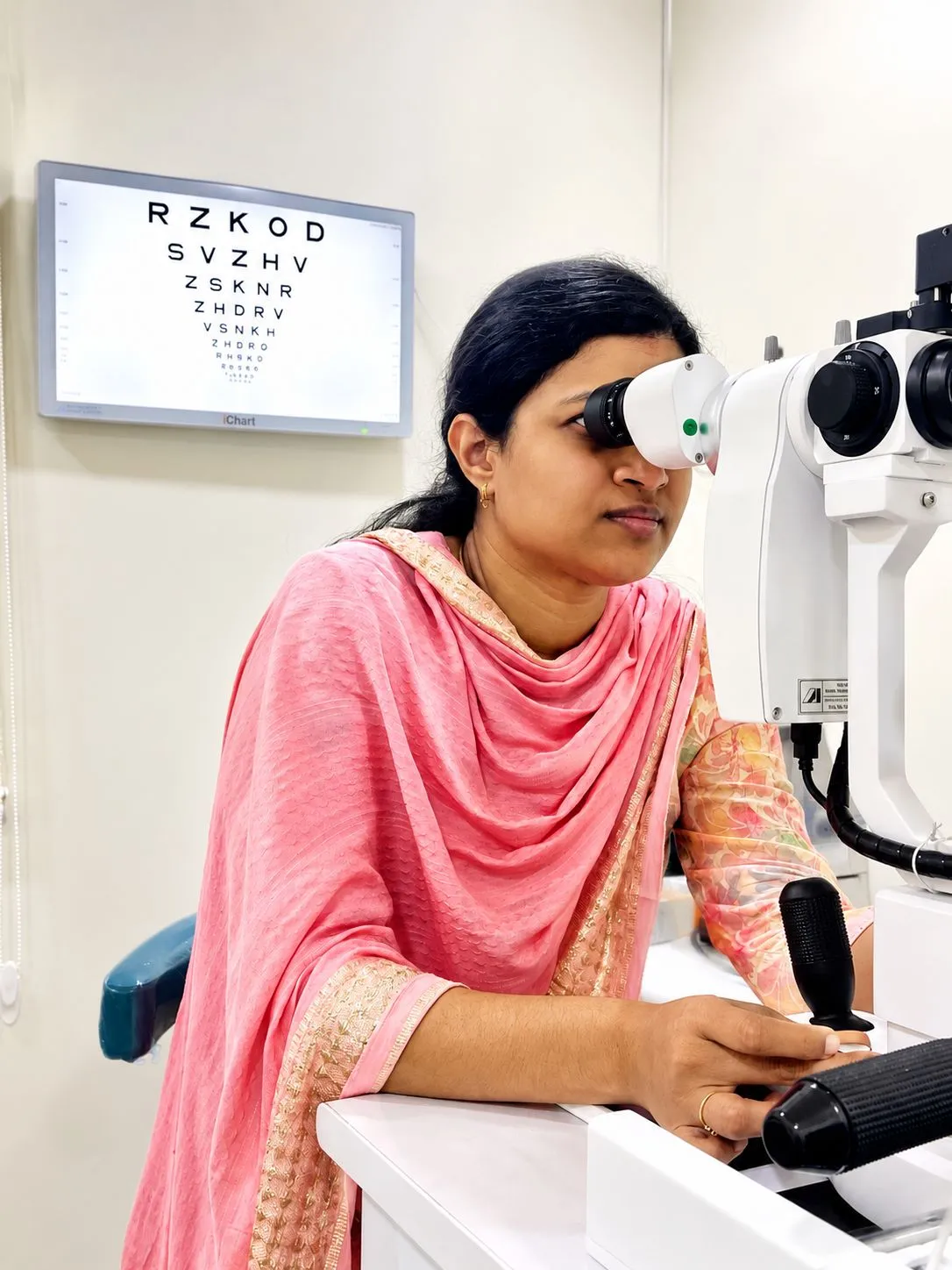 Dr. Rajeswari examining a patient at the slit lamp
